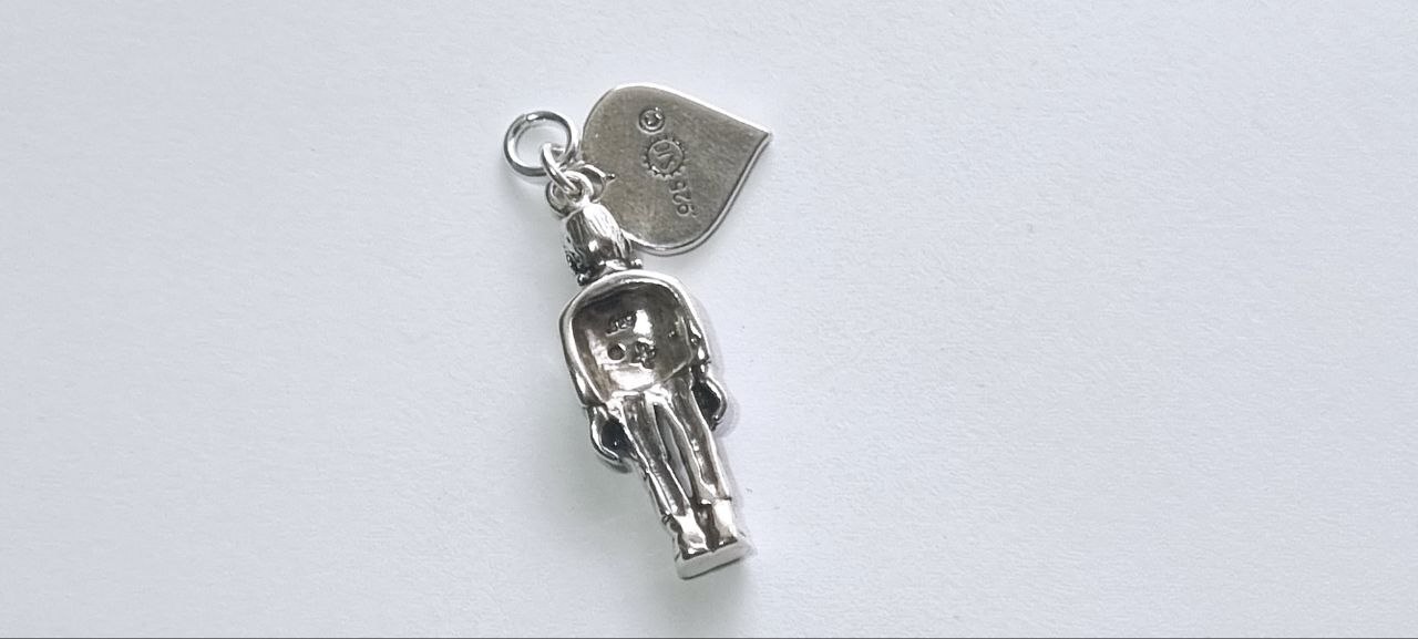 Reverse of BRIDE heart tag showing 925 sterling silver stamp