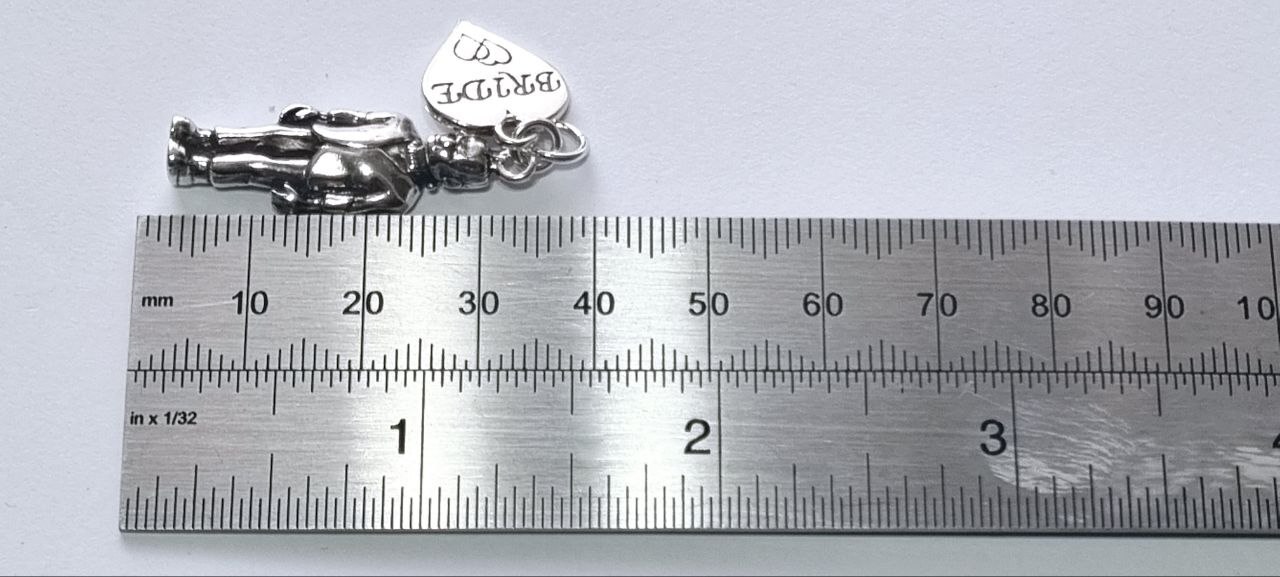 BRIDE heart tag and Frankenstein charm against ruler